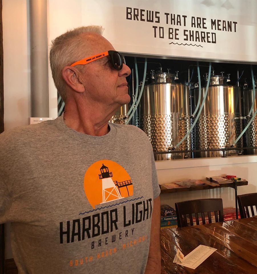Tom wearing sunglasses and a Harbor Light T-shirt